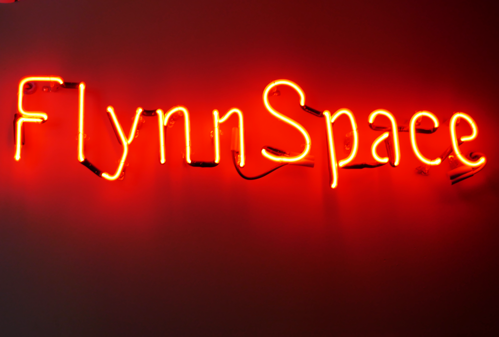 Flynn Space neon sign.